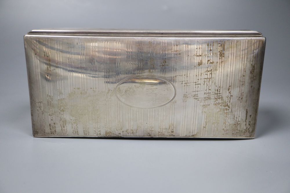 A silver mounted cigarette box. 19.5cm, a silver card case and a tortoiseshell and ivory aide memoir.